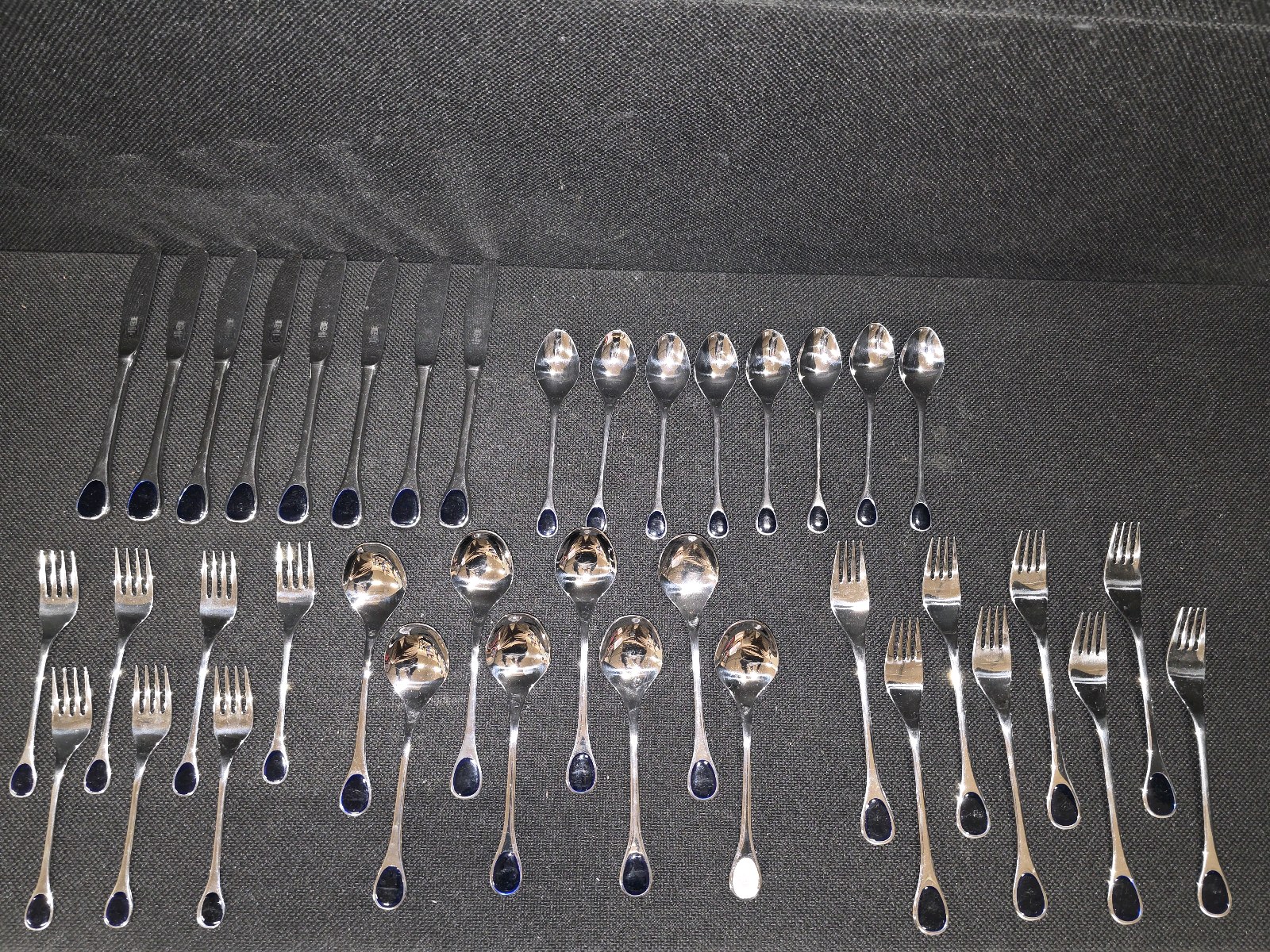 Vintage Frst Besteck Flatware (Silverware) set in the Happy Day pattern, featuring unique dark, rounded handles.