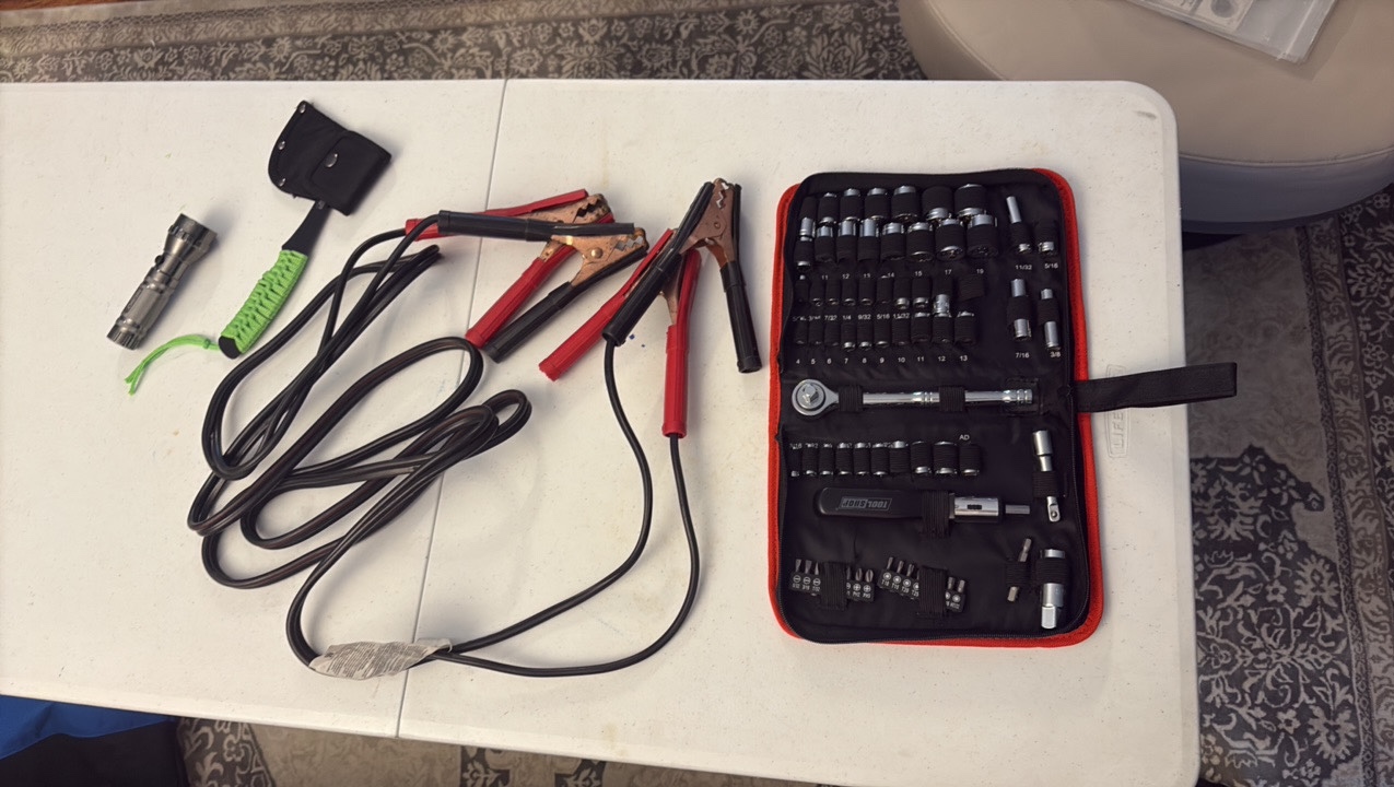 SOCKET set, jumper cables, axe, and flash light