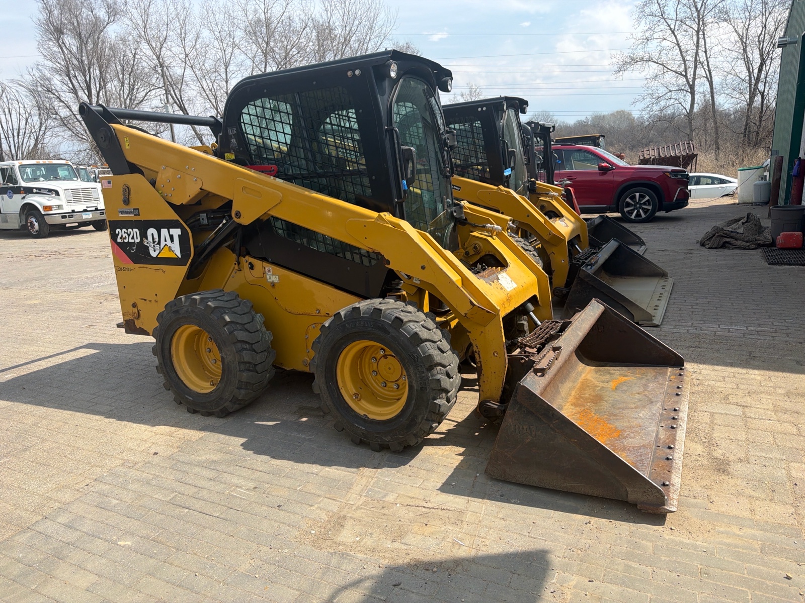 CAT 262D vertical-lift skid steer loader with bucket