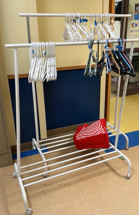 two rolling rack racks with hangers