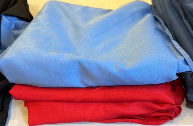 Red round tablecloth and blue table cloth