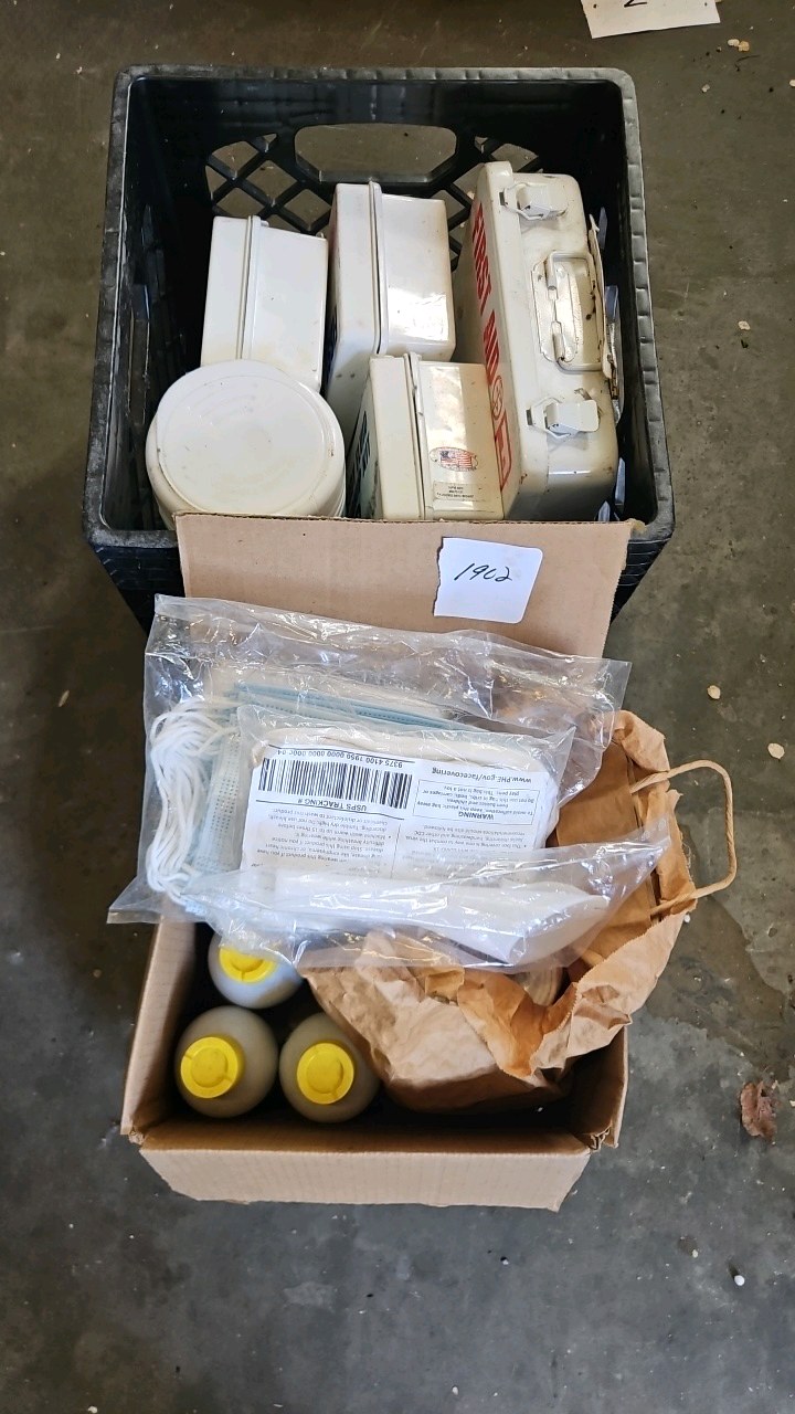 crate of first aid hand sanitizer masks