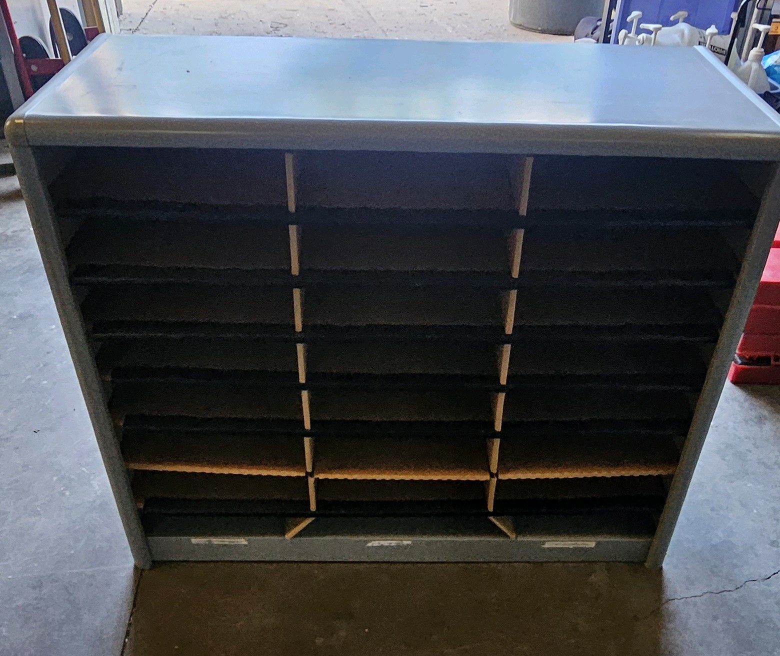 metal mailbox with cardboard shelving