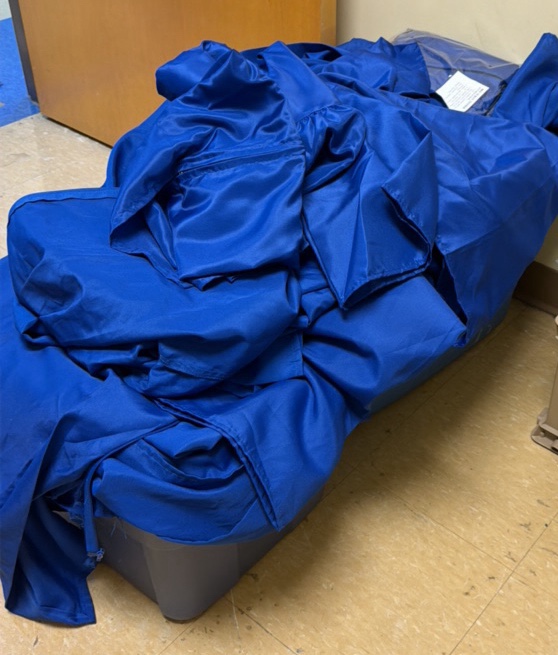 Blue cap and gowns two totes and a crate