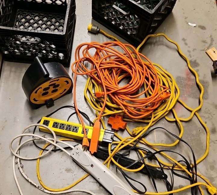 crate of extension cords and extension Outlets