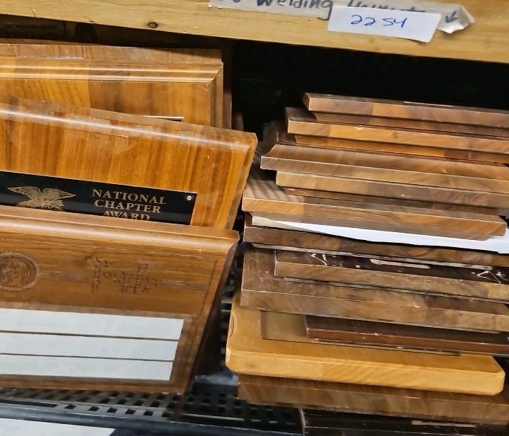 shelf of plaques new and used