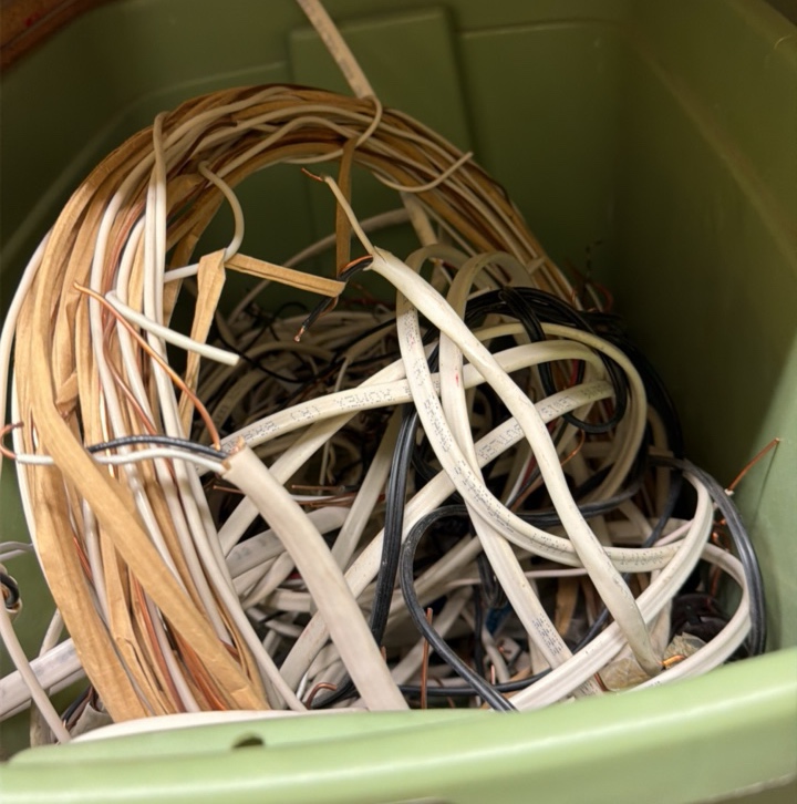 two crates lightbulb plate wire, grinding wheel