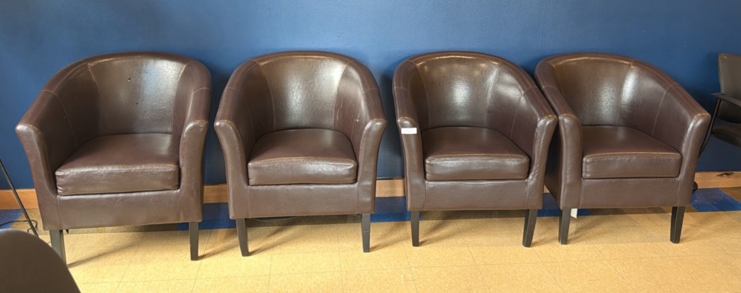 four leather chairs, two with minor damage