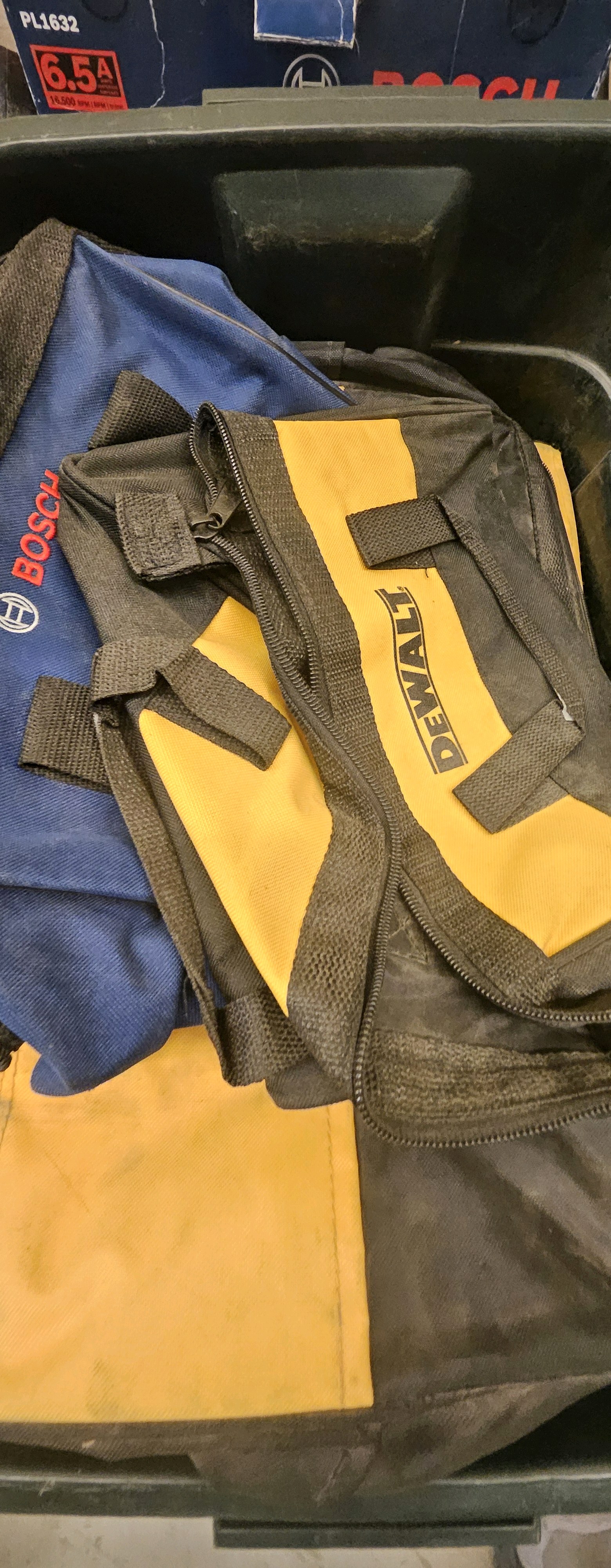 assortment of fabric tool bags