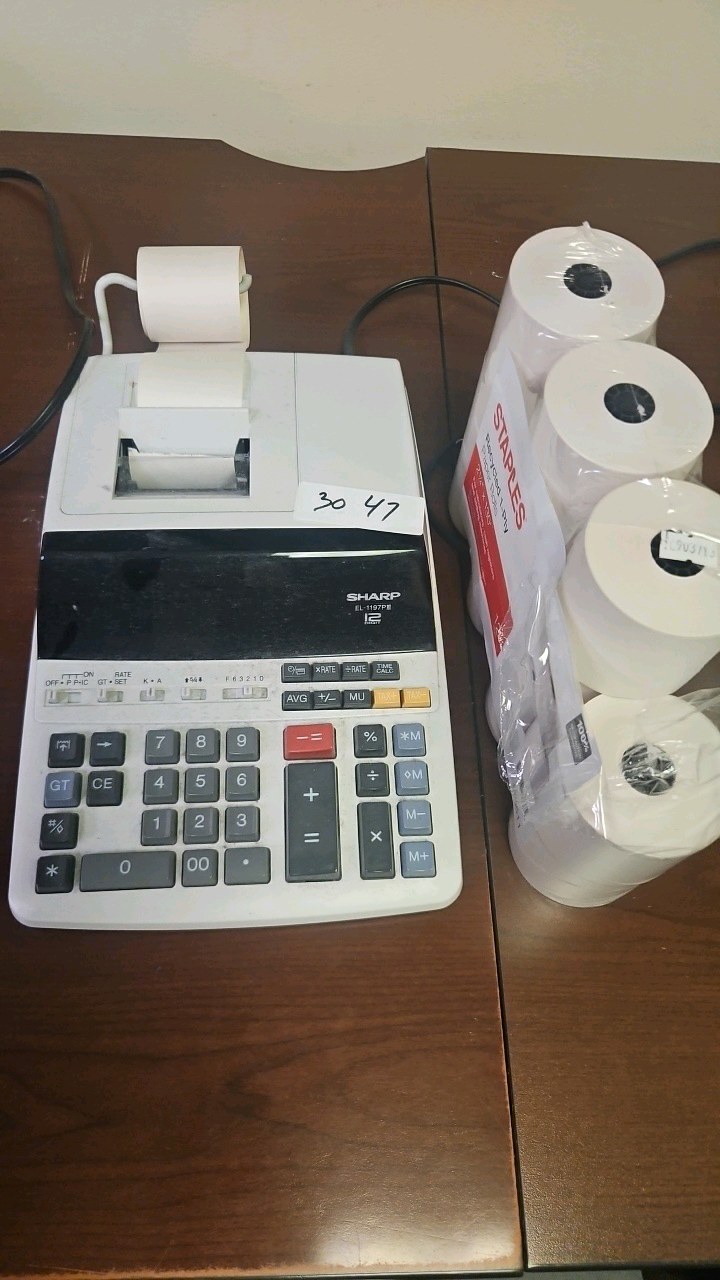sharp desktop calculator with printer rolls