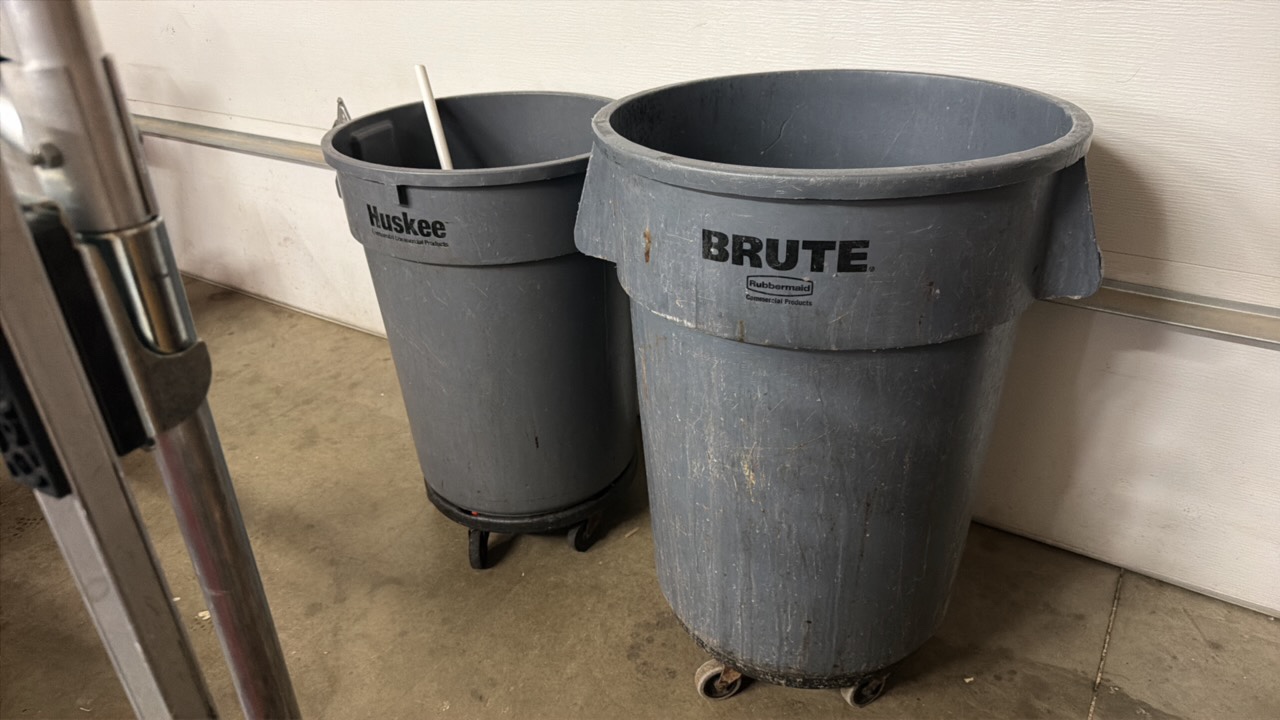 two trash cans on wheels