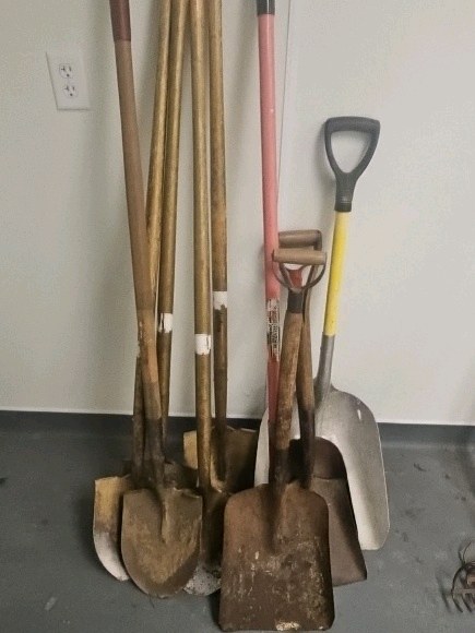 assortment of shovels and Spades