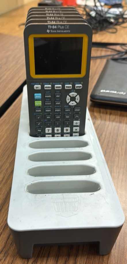 T1 84 Texas instrument calculators six missing the charger for the charging station