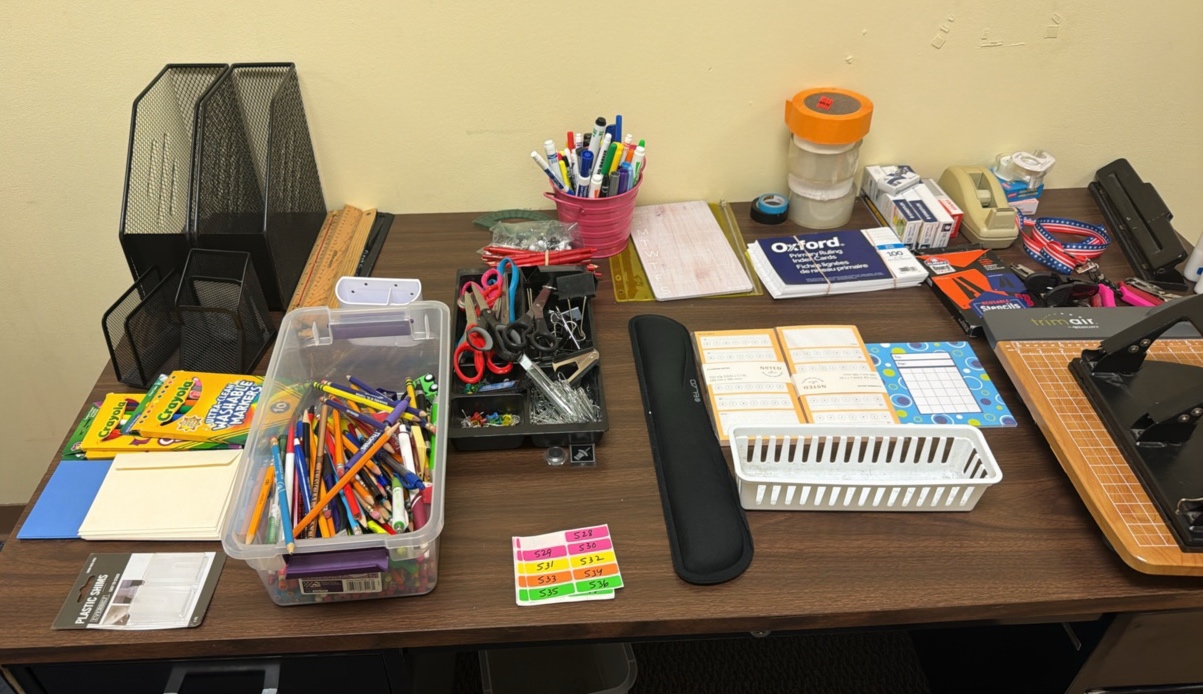 lot of office supplies, pencils, markers, scissors, dry, erase markers, rulers, notepads, staples, three whole punch glue