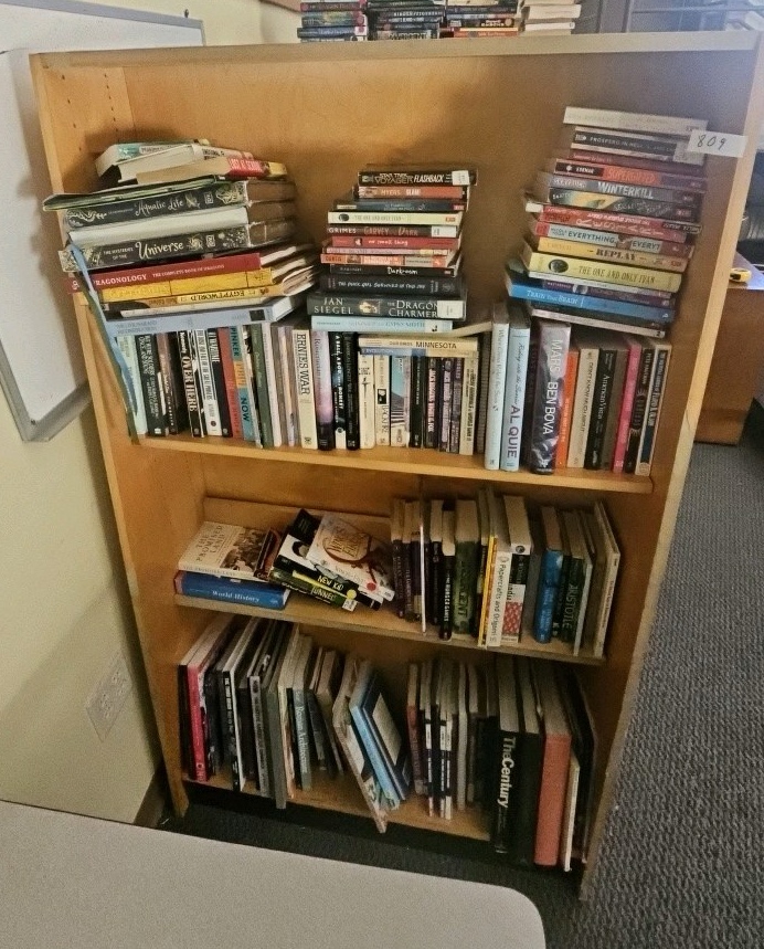 books on shelf bookcase not included