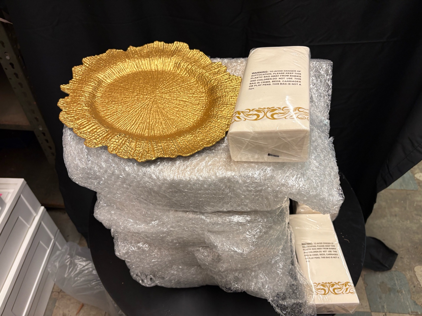 Gold Colored Plate and Napkin Set for Special Events, Weddings, Parties, Banquets, Looks Like There Are 100 Plastic PlatesPlate Accents and 4 Packs of Decorative Gold Colored Napkins, PlatesPlate Accents are Still in Original Bubble Wrap