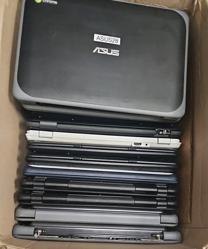 box of broken Chromebooks