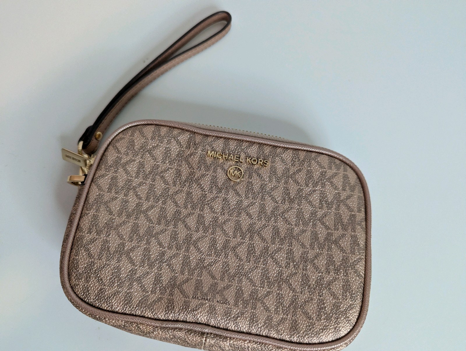 Michael Kors metallic rose gold monogram wristlet, Like New