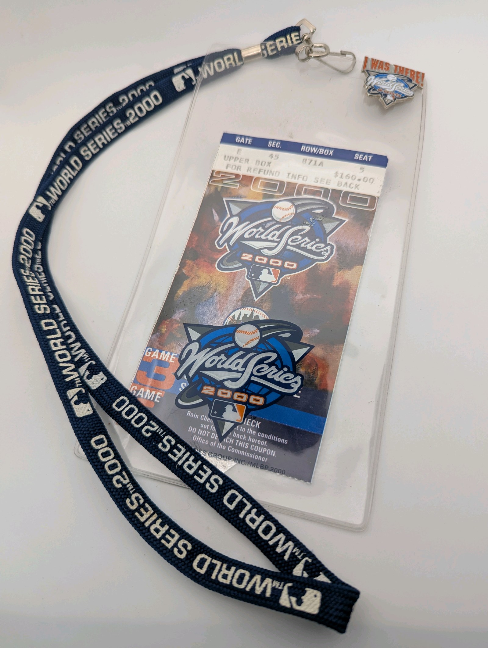 2000 World Series collectible set featuring a New York Yankees vs. New York Mets ticket stub, a branded lanyard, and an I Was There pin