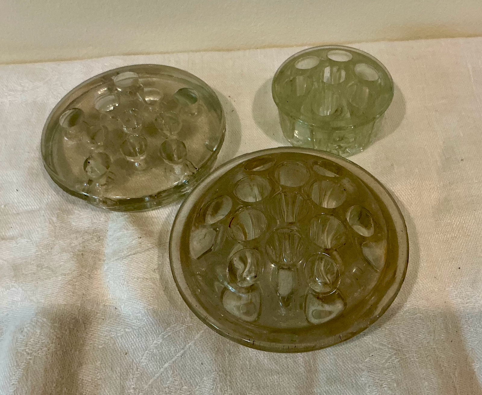 3 glass vintage flower frogs