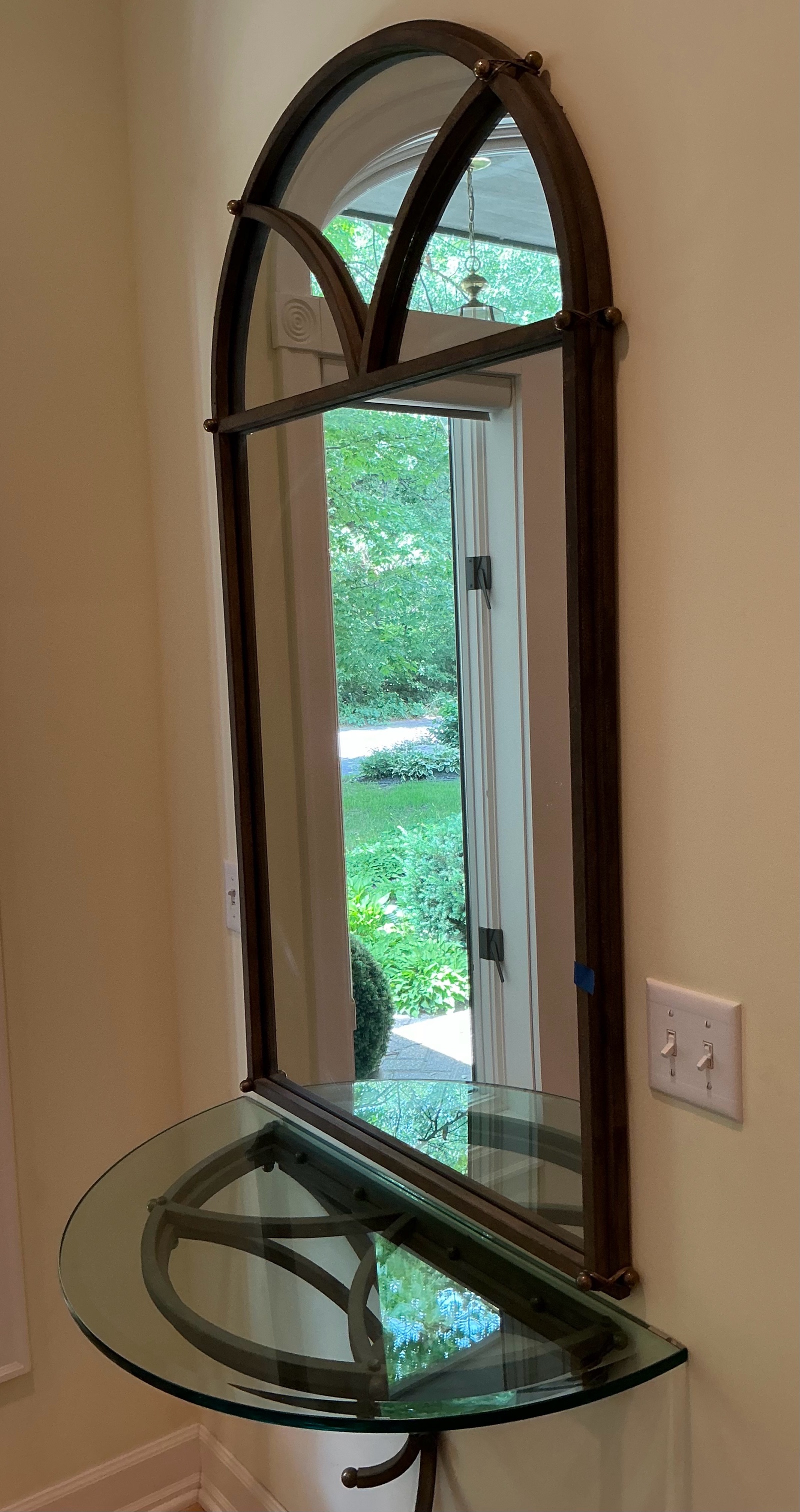 Ornate arched entryway mirror with matching wall console