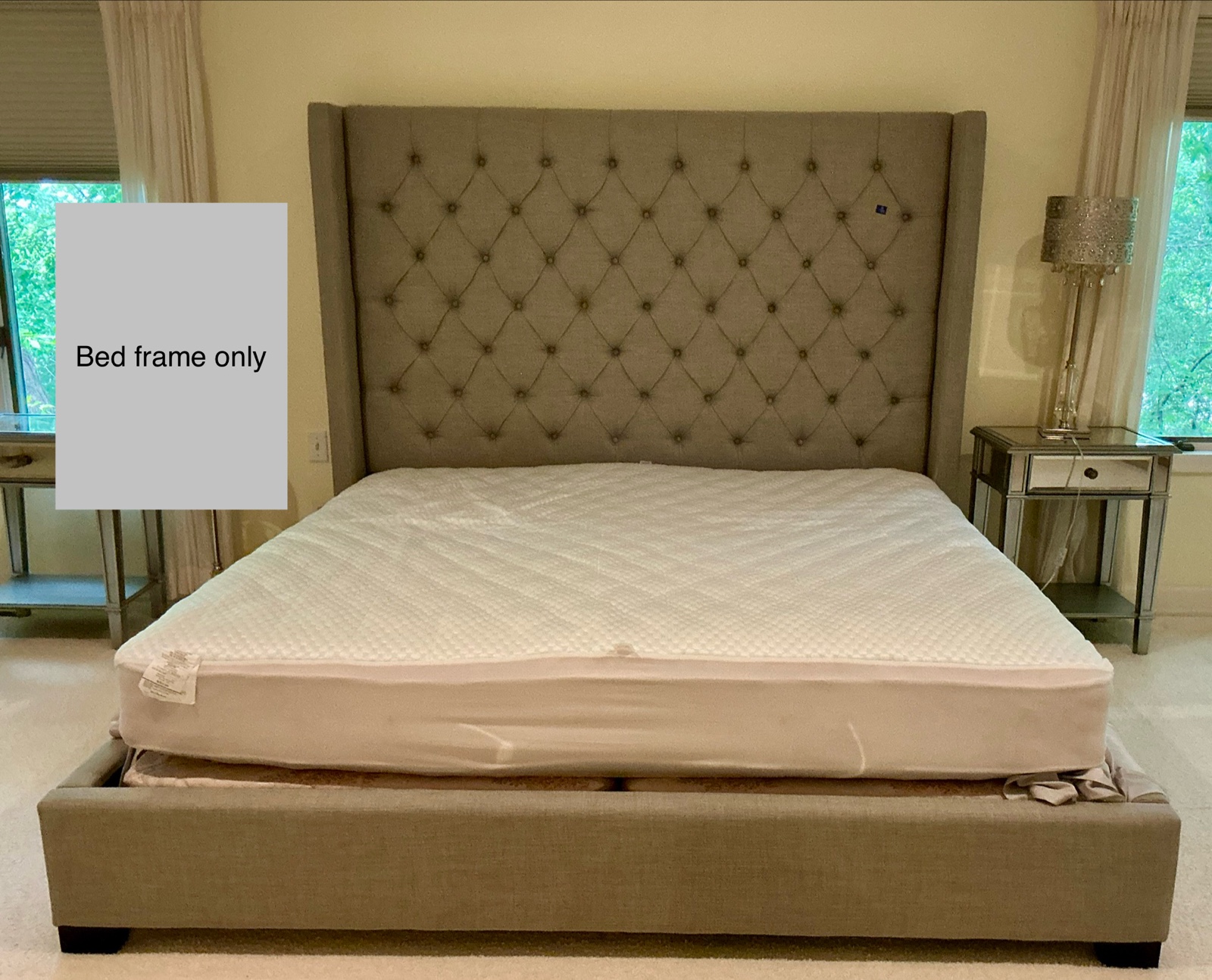 King sized light grey, button tufted wingback bed, upholstered headboard, low profile frame