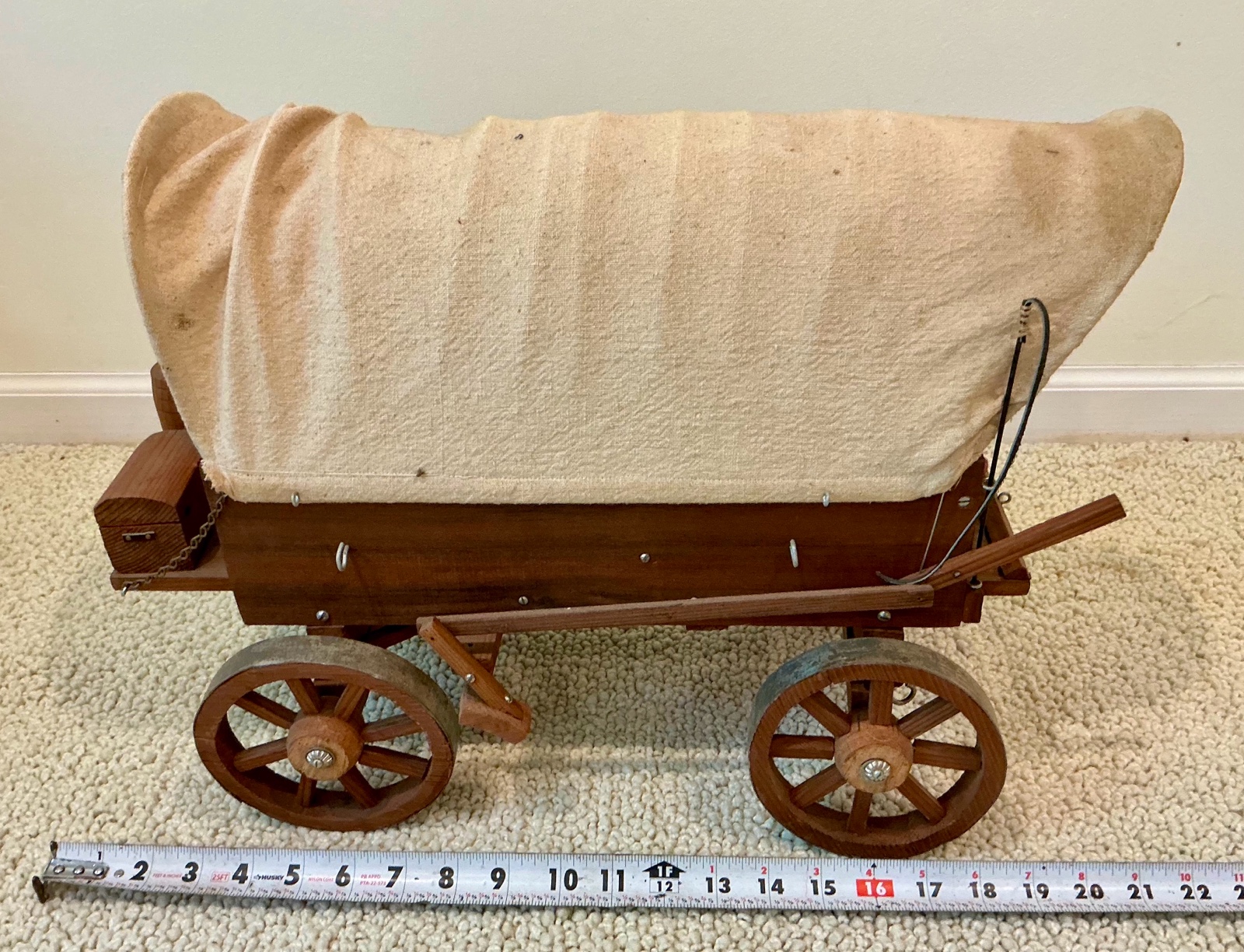 Vintage miniature wooden covered wagon with celluloid people toy display
