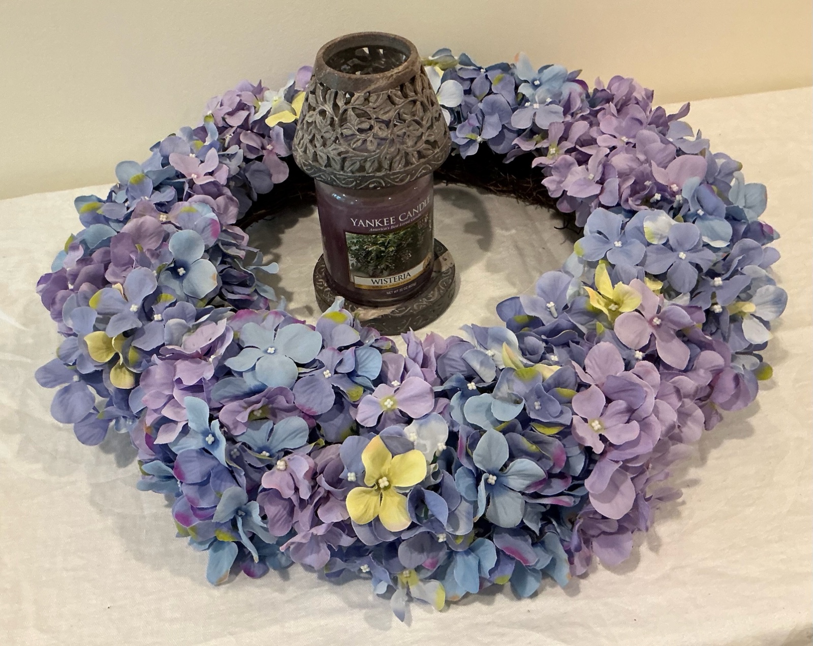 Group of purple decorations, wreath, candle