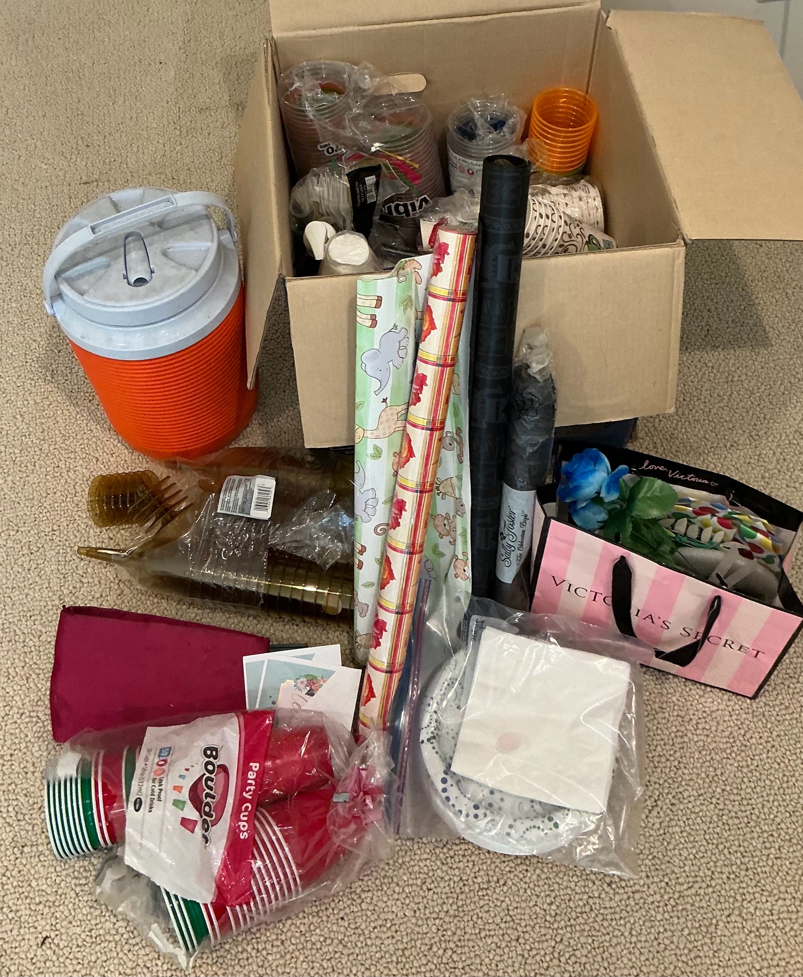 Various paper plates, plastic cups, party supplies
