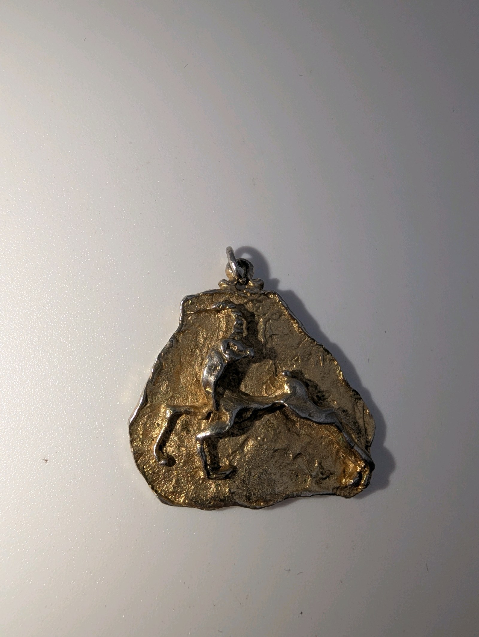 Brutalist-style zodiac pendant, Aries