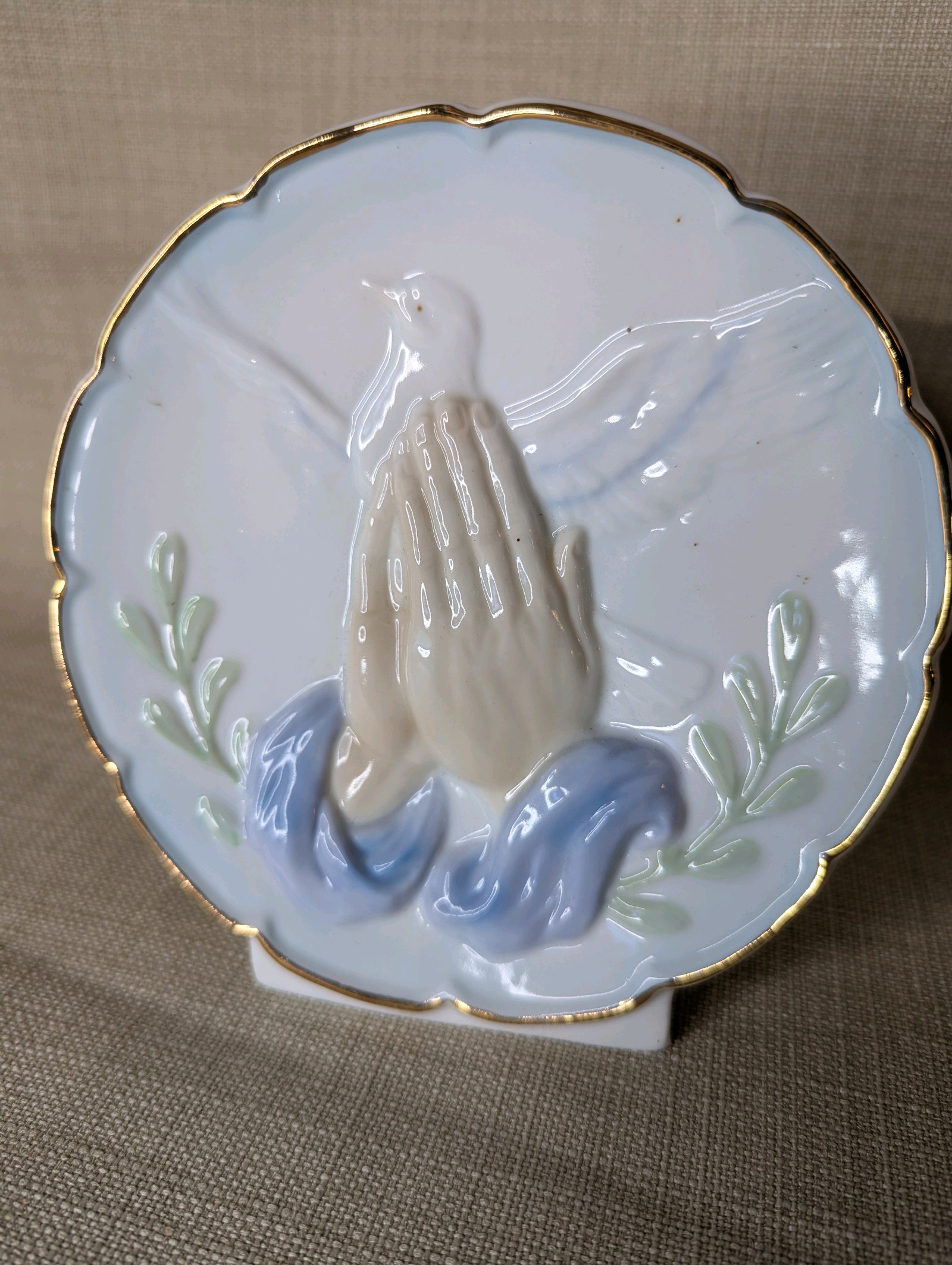 Vintage ceramic decorative plate features a 3D praying hands and dove design