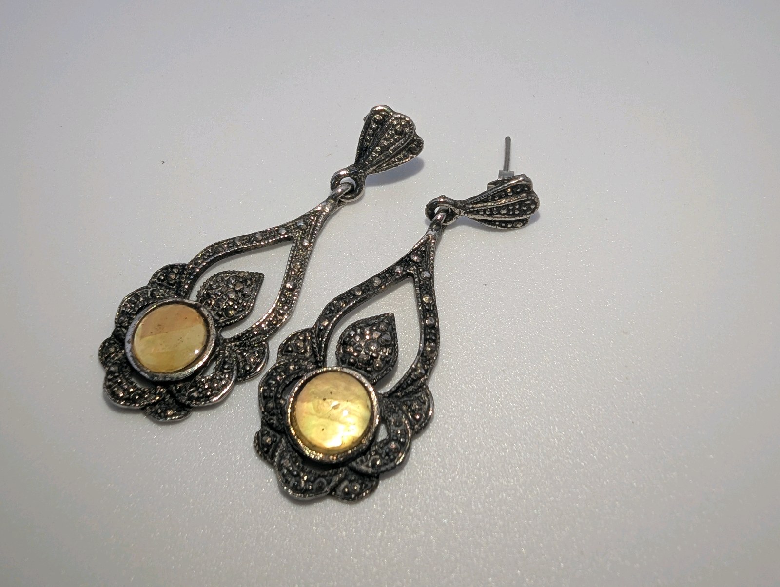 Sterling Silver Earrings Marcasite accents with a bezel-set yellow center stone