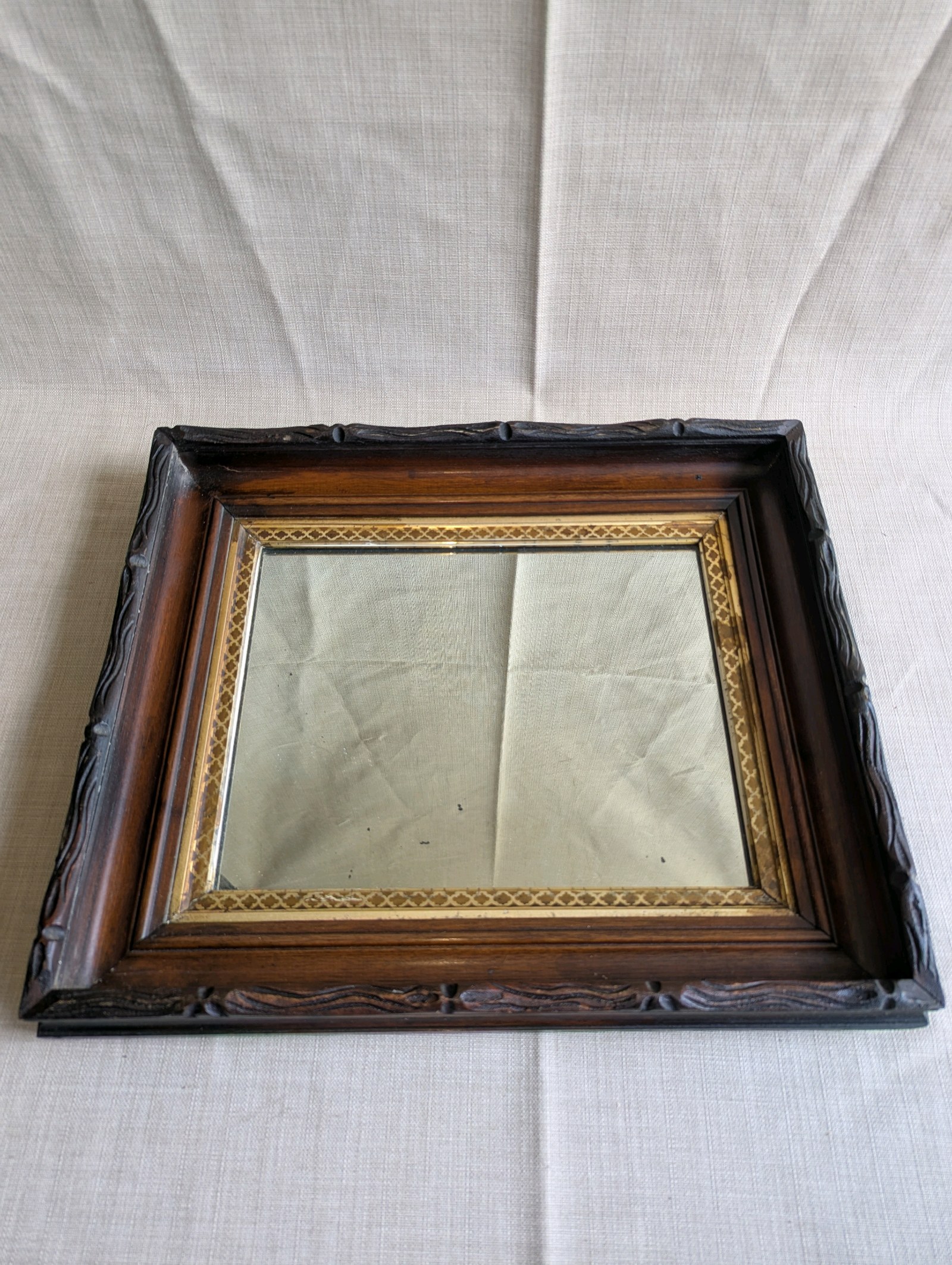 Antique Victorian Eastlake shadow box frame mirror,dark walnut wood exterior and an ornate gold gilt trim