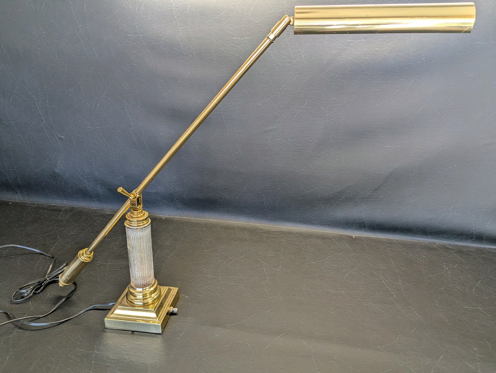House of Troy polished brass desk lamp, adjustable swing arm and a fluted crystal column