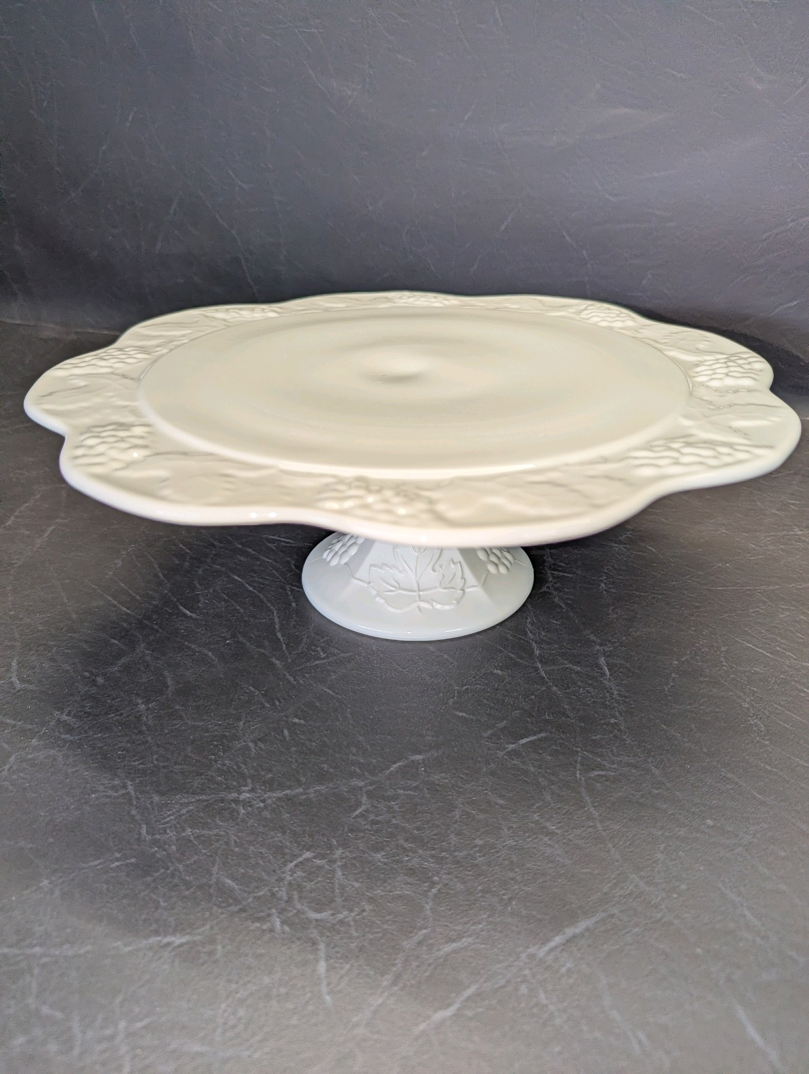 Vintage Indiana Glass Colony Harvest grape cake stand is crafted from white milk glass