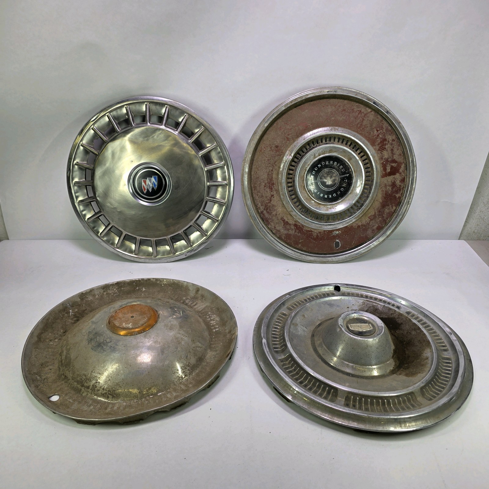 Lot of 4 Vintage Mixed Automotive Hubcaps Cadillac Buick Thunderbird Wheel Covers