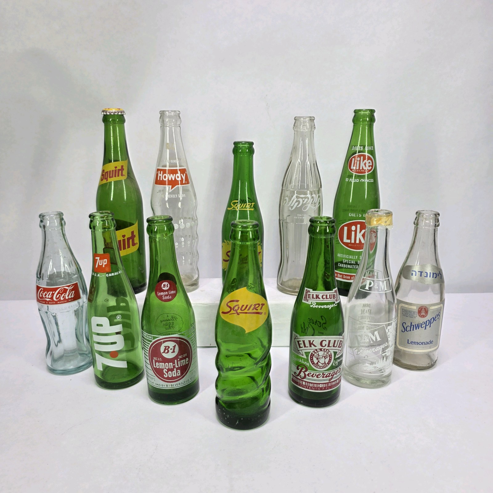 Lot of Vintage Soda Bottles 7UP Squirt Nesbitts Like Vernors Coca-Cola