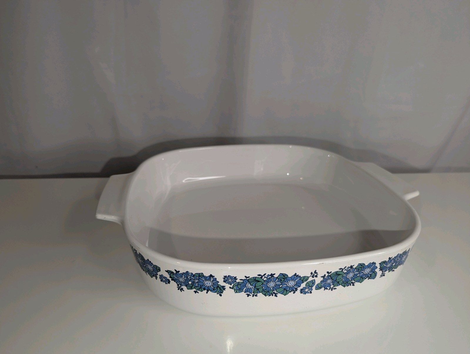 Vintage Corning Ware casserole dish in the "Evening Song" pattern, no lid