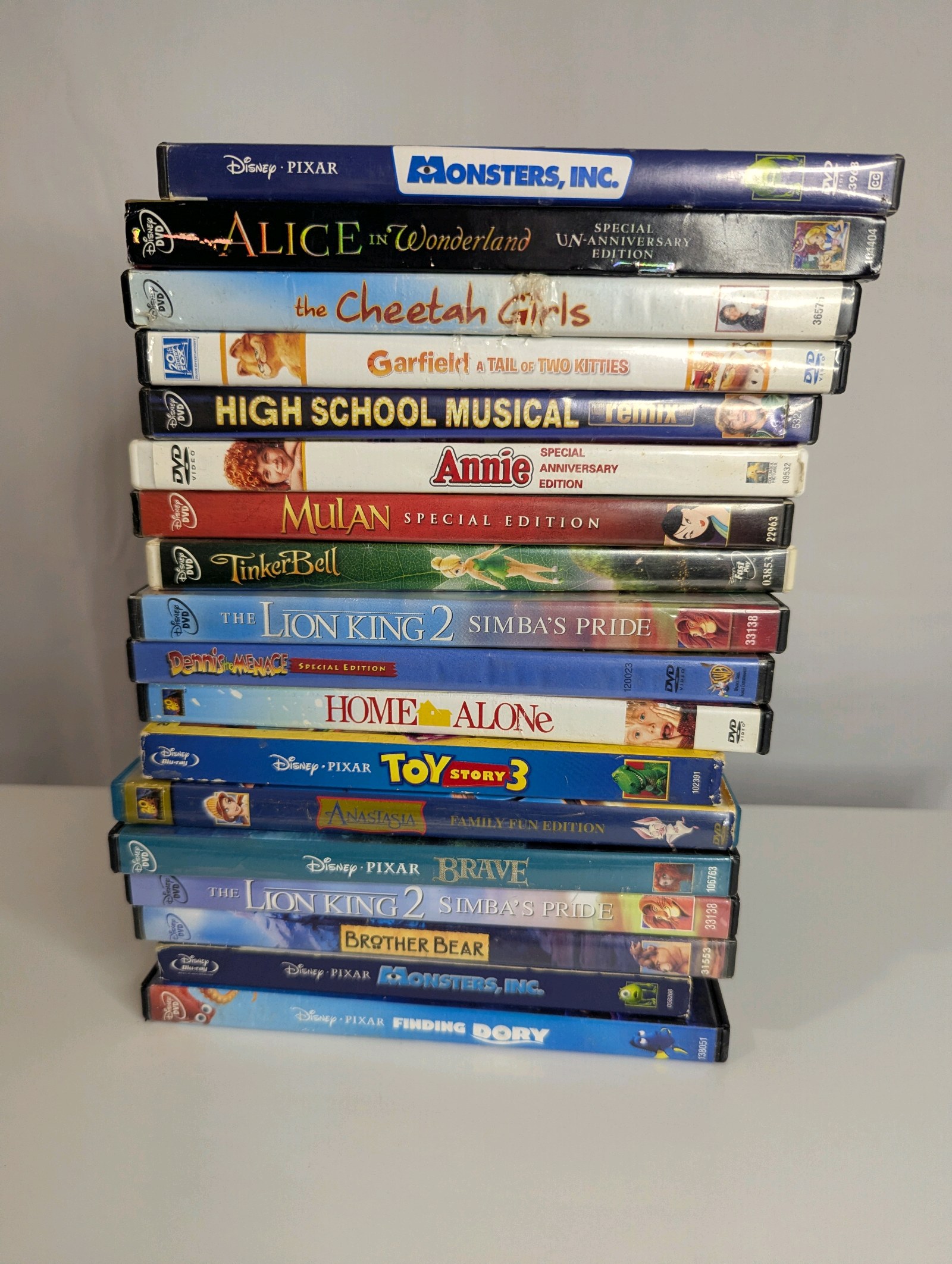 Collection of Disney and family-friendly DVDs, including popular titles like Monsters, Inc., Toy Story 3, and The Lion King 2 Simbas Pride